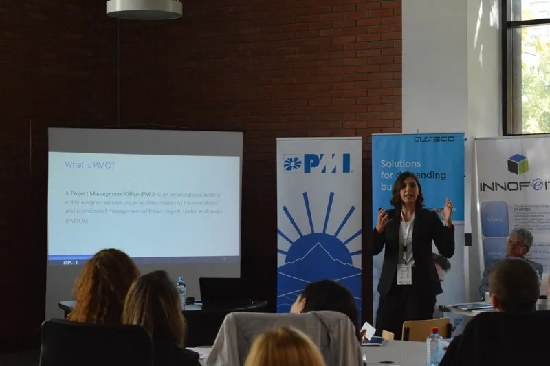 A speaker explaining what a project management office is to the room